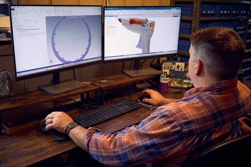 Ferra engineer hard at work custom rendering a metalworking project on his advanced computer. Only the best work from Ferra manufacturing, the best in fabrication, structural steel, and custom metalworking!