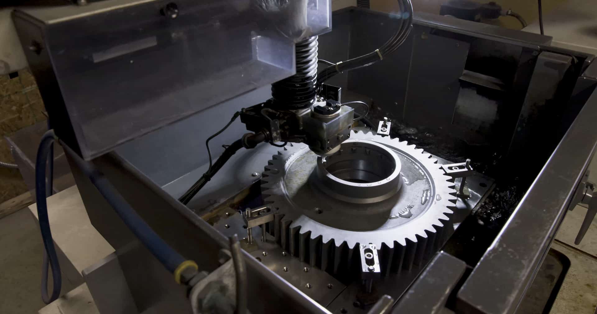 Wire EDM machining in progress on a precision metal gear component